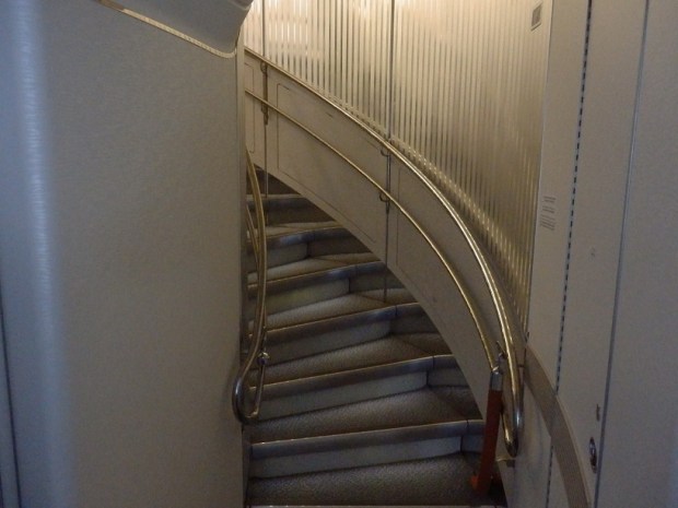 STAIRS FROM ECONOMY TO BUSINESS CLASS AT REAR OF THE PLANE